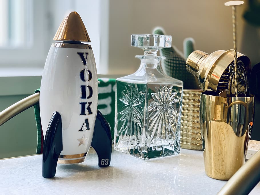 rocket toy beside decanter, bottle, table, no people, container HD wallpaper