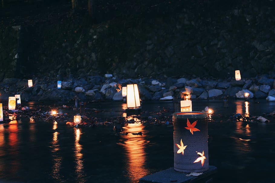 lamps on rocks, illuminated, candle, religion, nature, night HD wallpaper