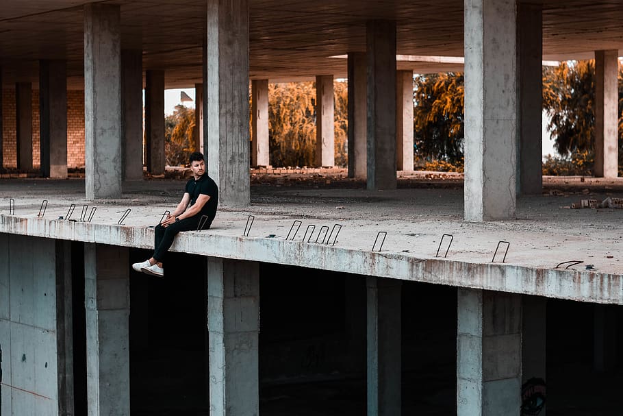 Man Sitting On Building Edge, architecture, person, pillars, built structure HD wallpaper