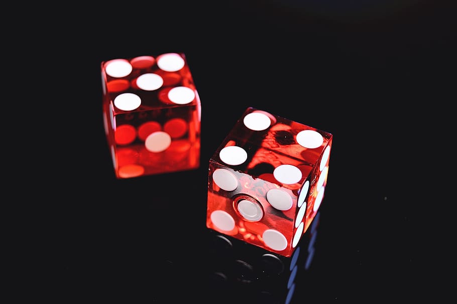 Double dice on black background