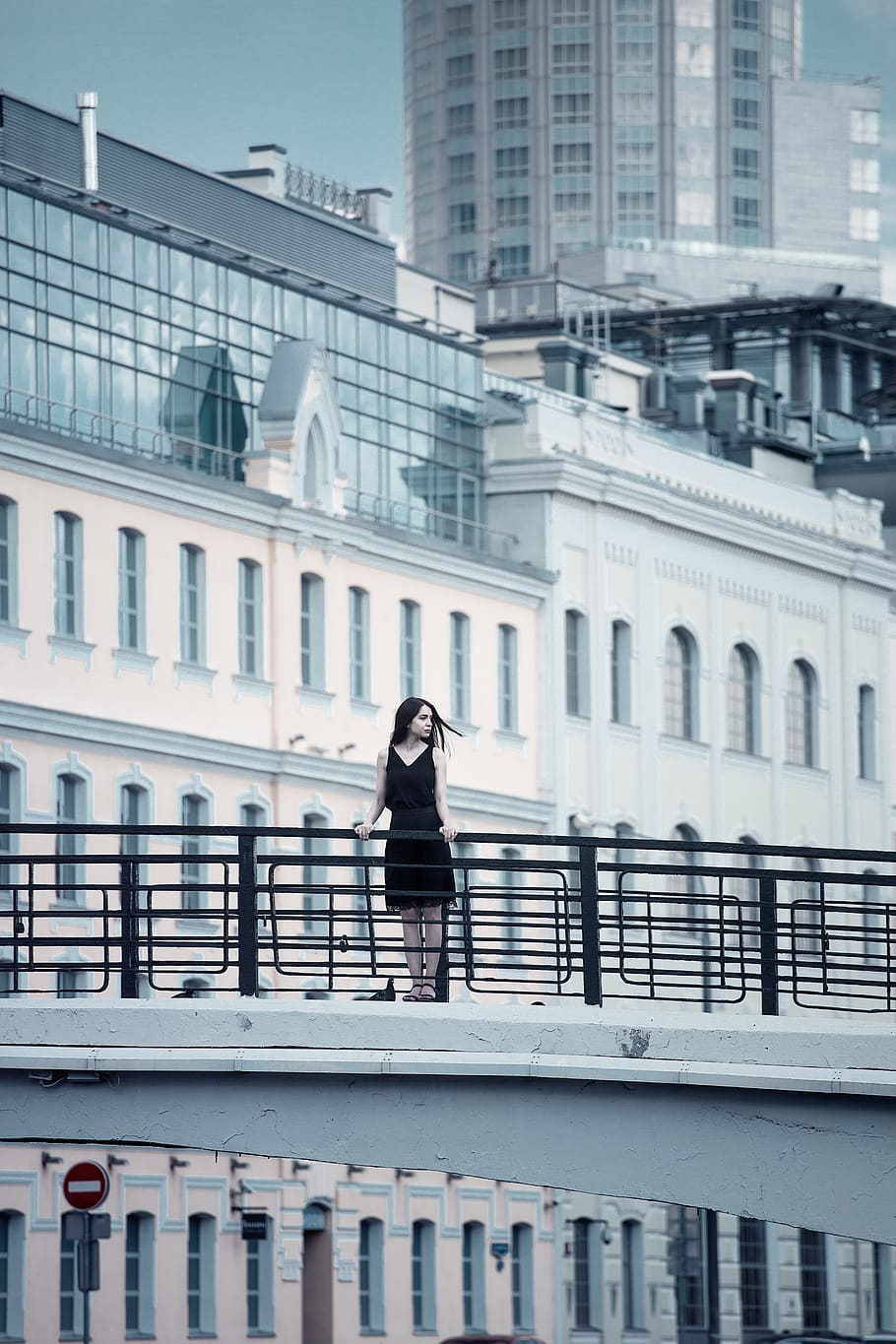 Woman Holding Fence, architecture, black dress, black-and-white