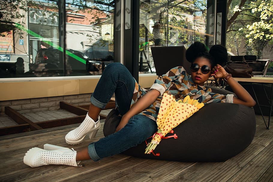 Woman Lying on Black Bean Bag Chair Near Cafe, café, chairs HD wallpaper