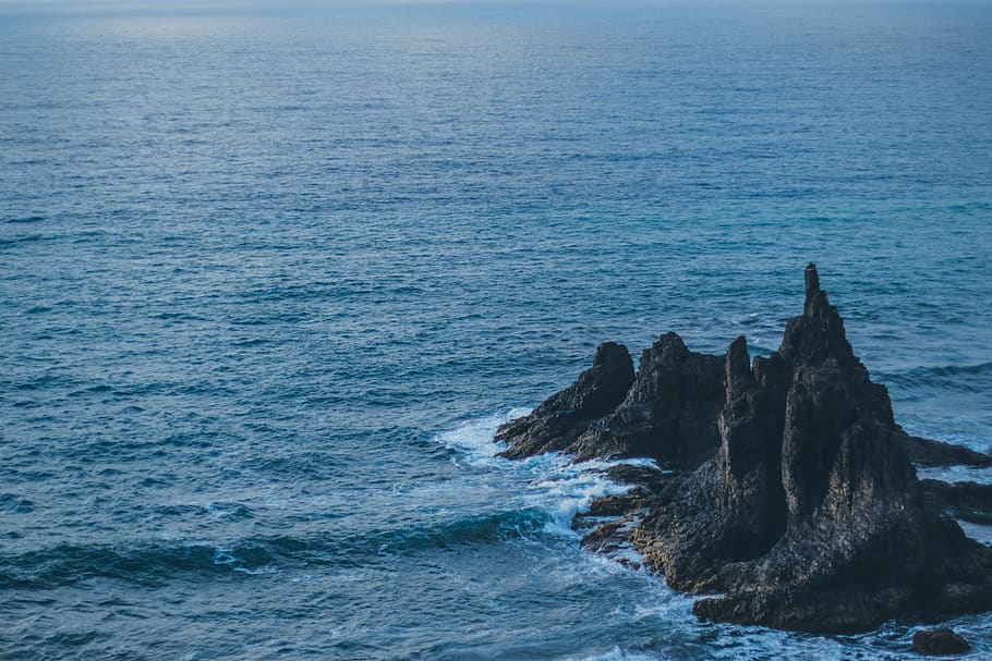 Brown Rock Formation on Body of Water, beach, daylight, high angle shot HD wallpaper