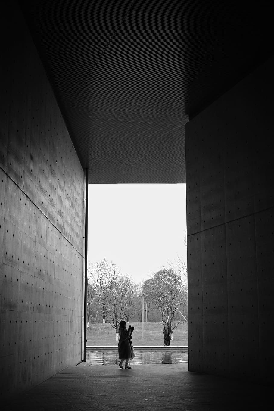 person standing in between building, human, path, pedestrian HD wallpaper