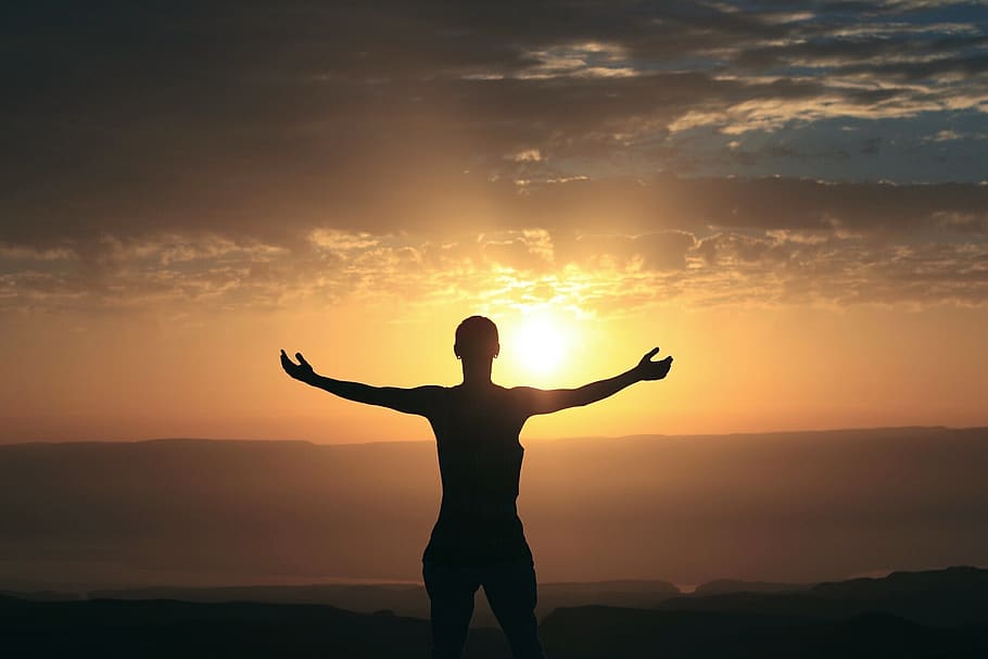 Silhouette Photography of Person Spreading Arms, backlit, clouds HD wallpaper