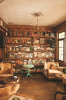 Brass-colored Chandelier, architecture, armchairs, bookcase, books HD wallpaper
