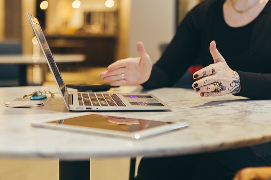 person showing laptop computer on table, wireless technology HD wallpaper