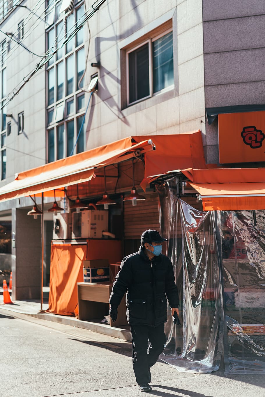man walking on street beside store during daytime, person, human, HD wallpaper