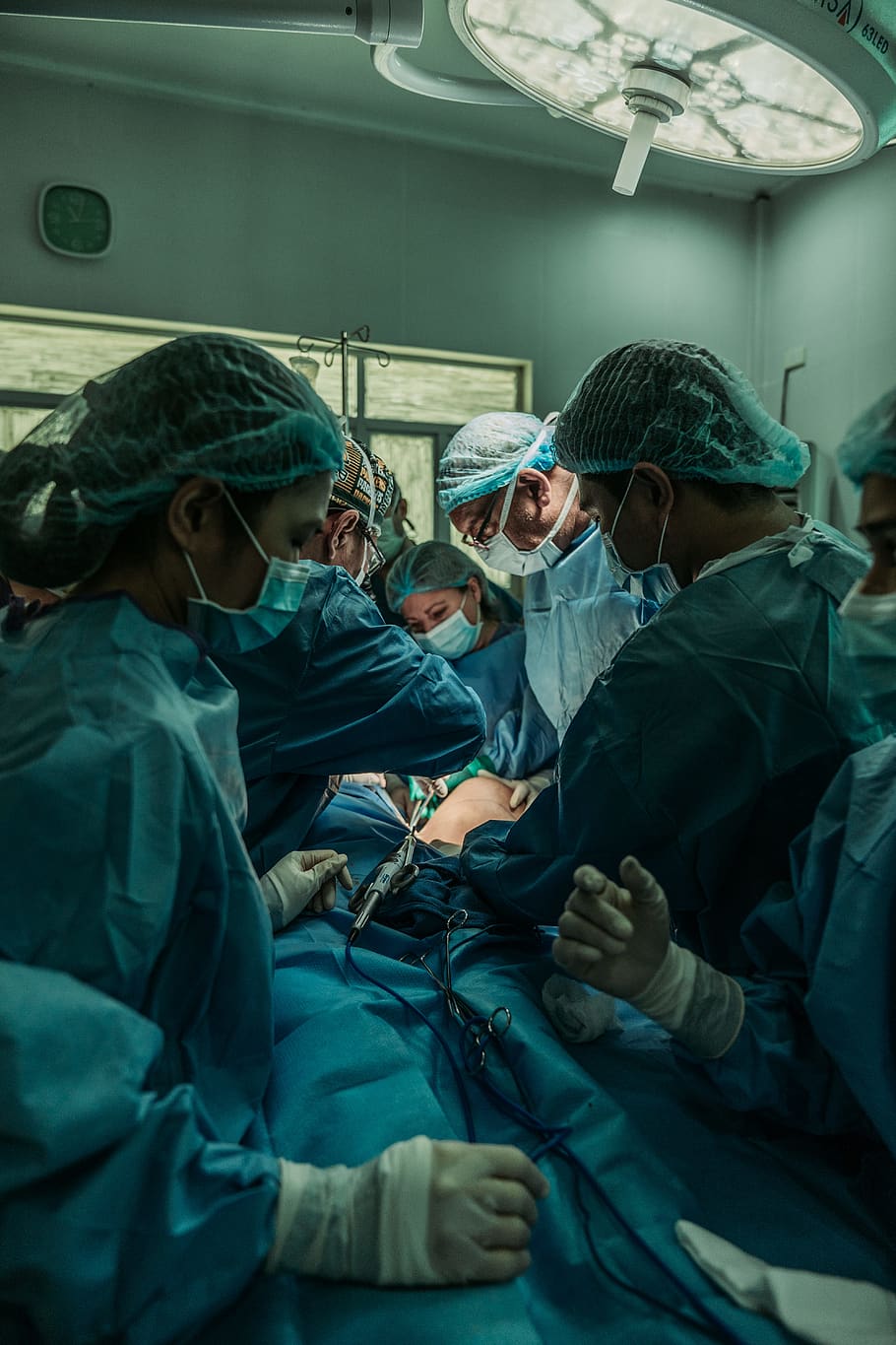doctor performing operation, occupation, healthcare and medicine