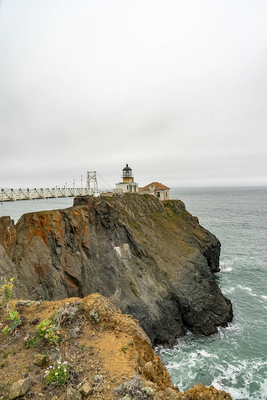 lighthouse, coast, waves, storm, bridge, nobody, fog, cloudy HD wallpaper