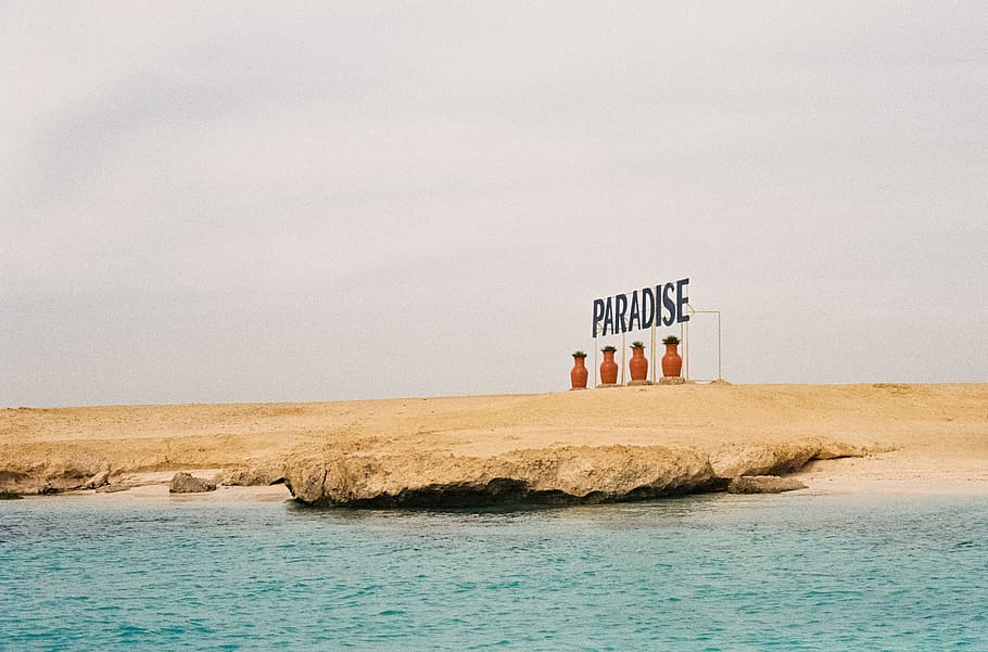 Paradise signage on seashore, beach, rock, stone, water, cloudy HD wallpaper