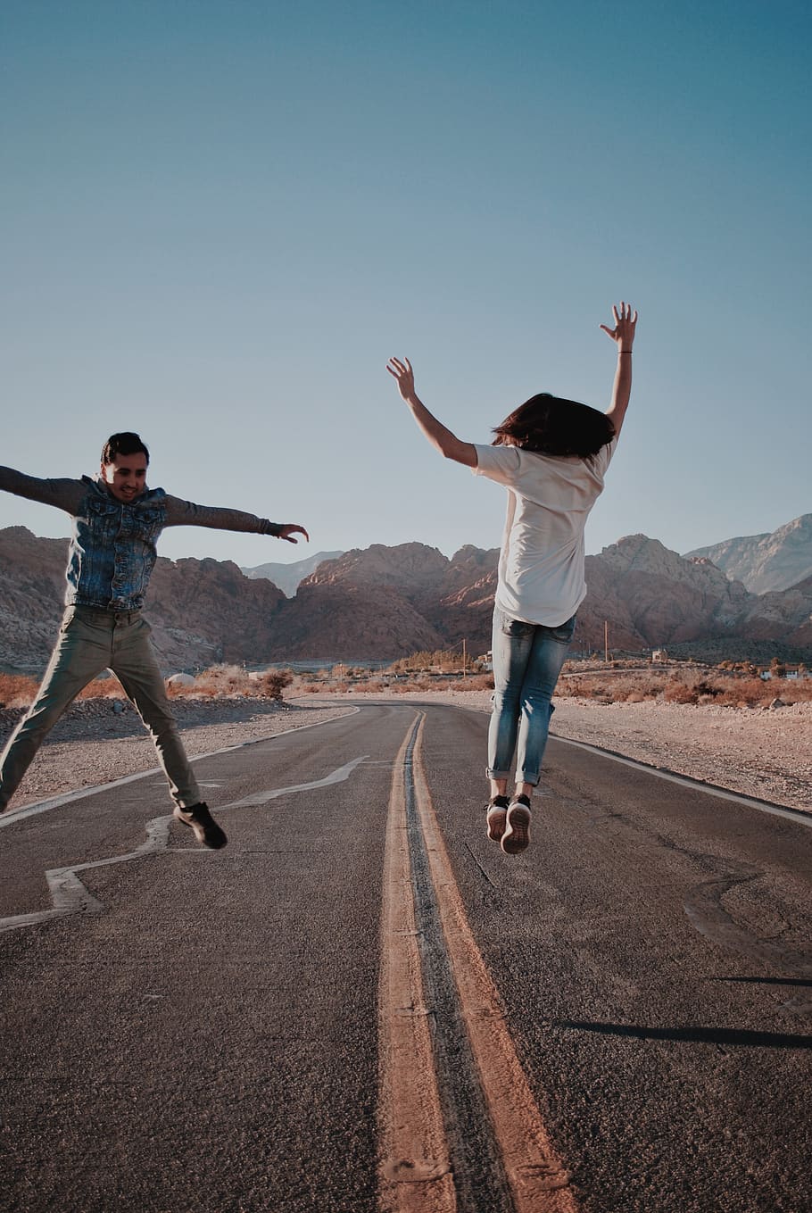 two person jumping on road, asphalt, tarmac, human, way, highway HD wallpaper