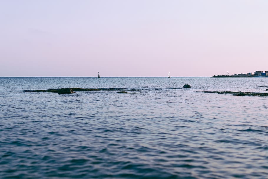 Body of Water Near Buildings Under White Sky, buoy, calm, ocean HD wallpaper
