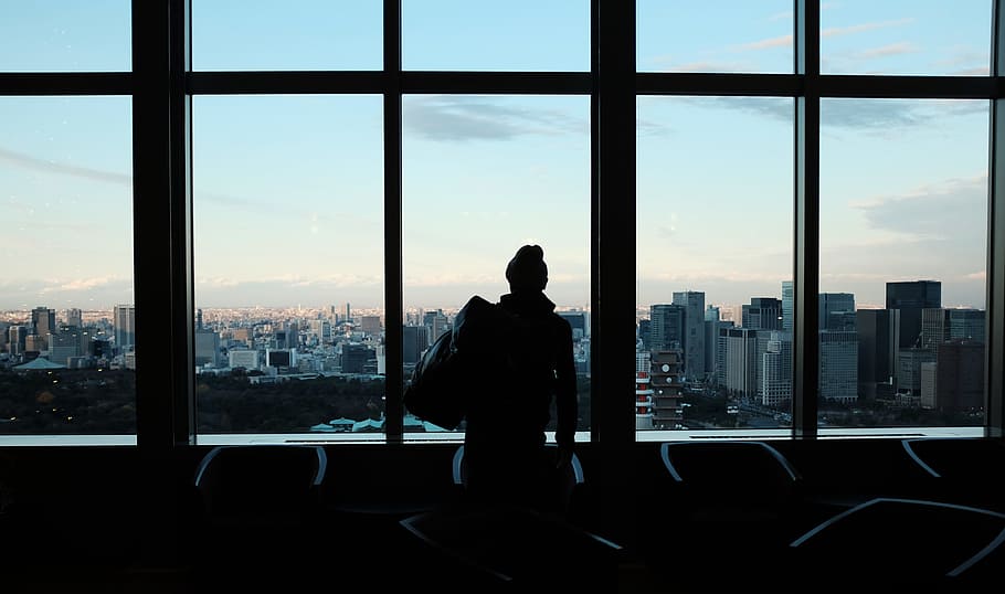 silhouette of person looking to glass window, back, city, architecture HD wallpaper