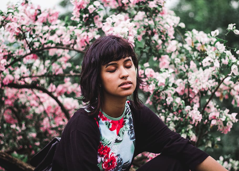 Woman Wearing White and Red Floral Crew-neck Shirt Near Pink Petaled Plant HD wallpaper