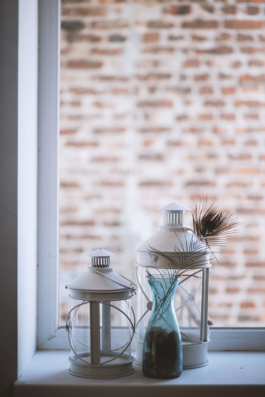 Two Clear Glass Lamp Lanterns Near Window, brick wall, decoration HD wallpaper