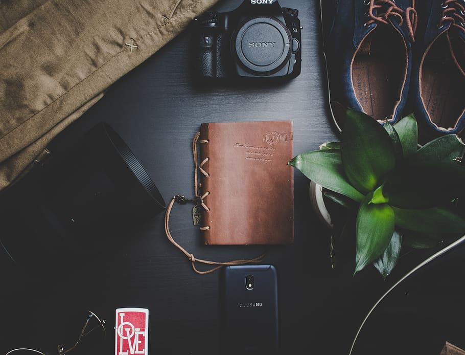 Black Sony Dslr Camera Beside Brown Notebook, dark, equipment HD wallpaper