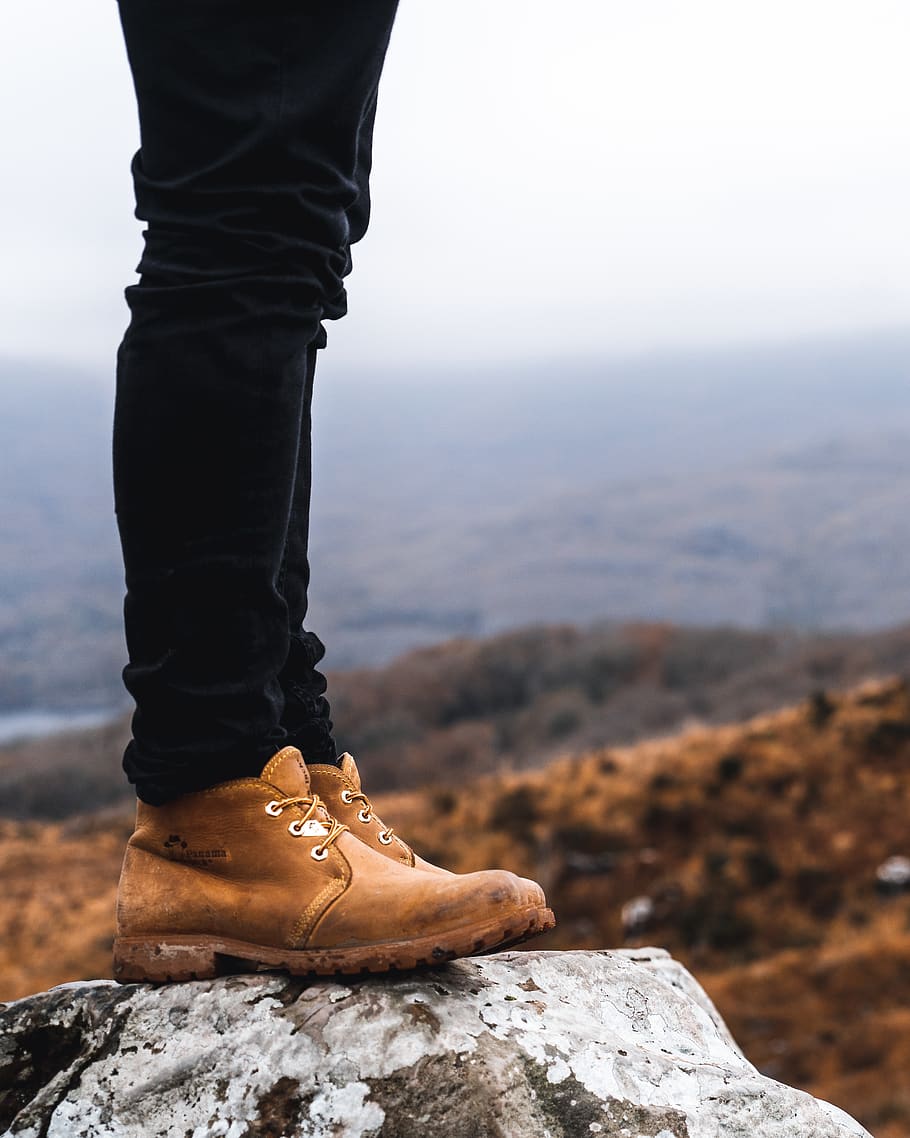 person standing on rock, low section, one person, human body part HD wallpaper