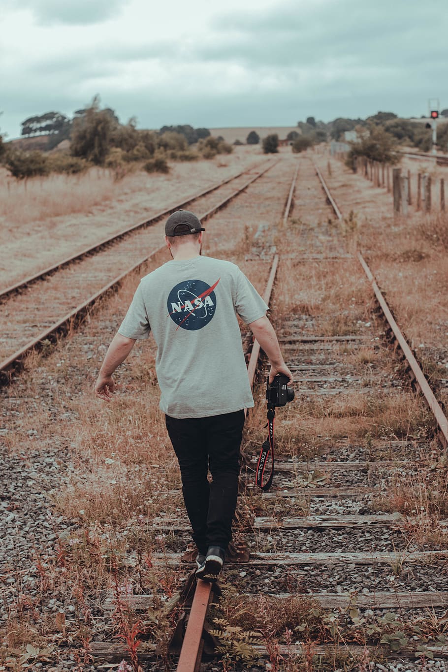 man walking on train rail, train track, railway, transportation HD wallpaper
