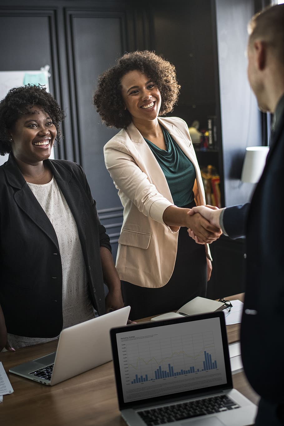 Woman Handshaking Man's Hand While Smiling, colleague, gadgets HD wallpaper