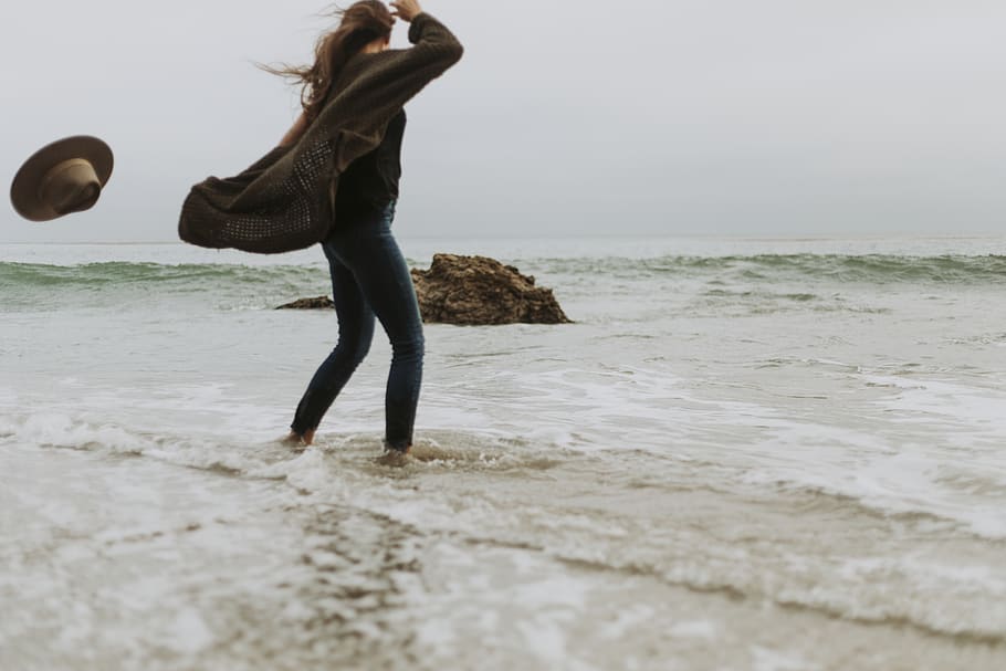 Woman Standing Near Seawater, beach, blond hair, blue jeans, daylight, HD wallpaper