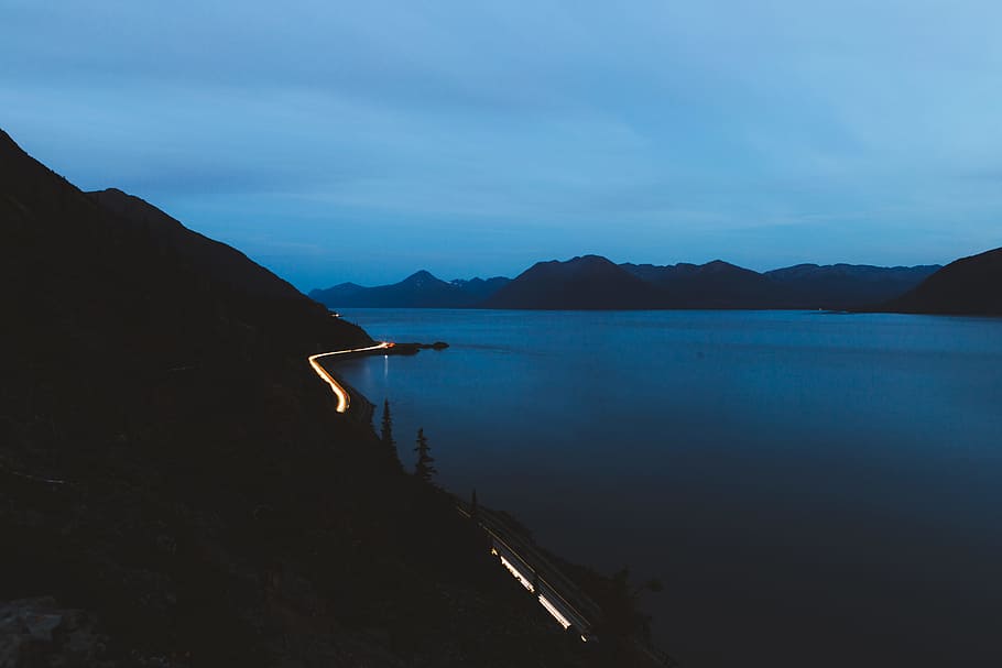 body of water between landscapes, lake, light, blue, forest, dark HD wallpaper