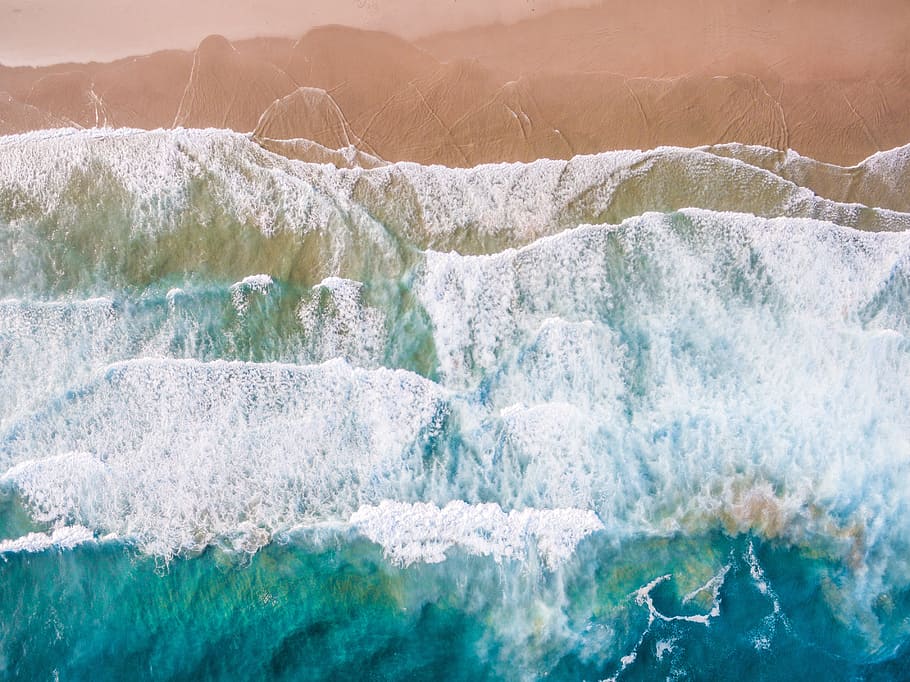 high-angle photography of waves towards shore, beach, from above