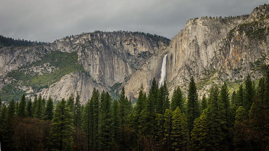 White Waterfalls Between Rocky Mountain during Cloudy Day, adventure HD wallpaper