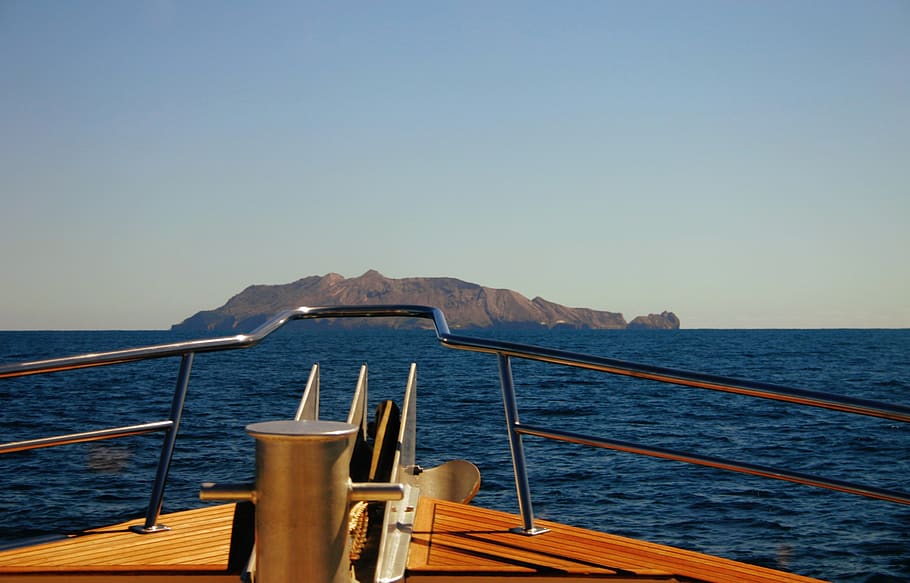Brown Boat Sailing on Sea, daylight, landscape, mountain, ocean HD wallpaper
