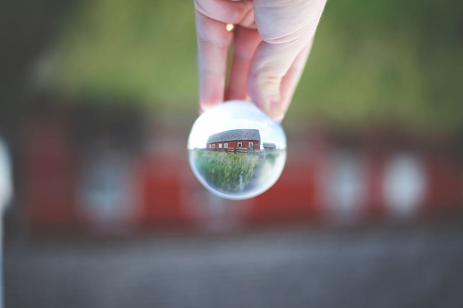 barn, lensball, red, rustic, grass, human body part, human hand HD wallpaper