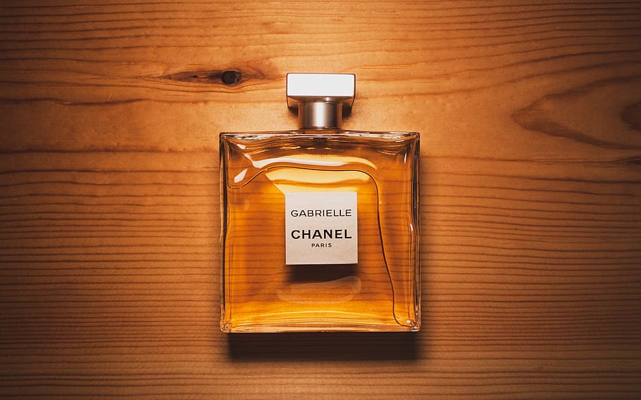 Hd Wallpaper Clear Glass Perfume Bottle On Brown Surface Brand Chanel Cologne Wallpaper Flare