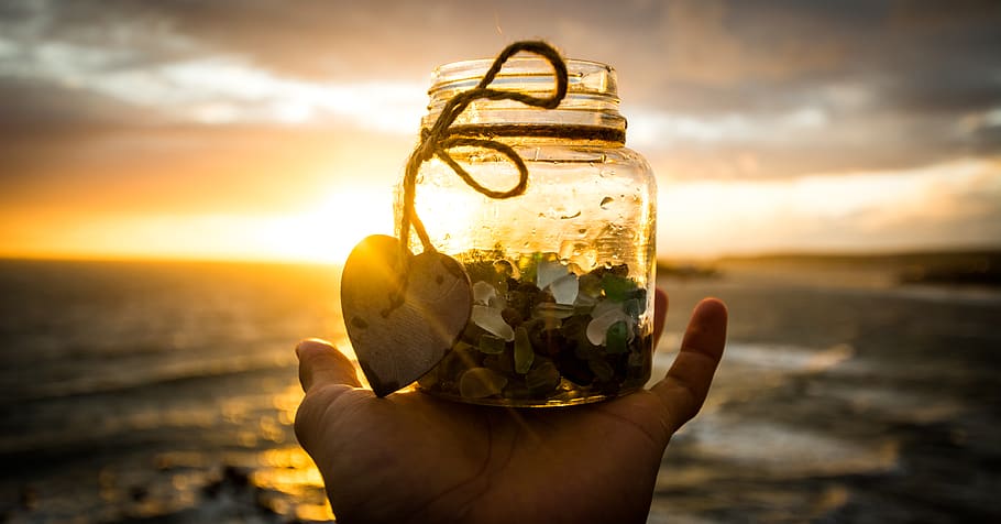 sunset, nature, glass, jar, ocean, sea, hand, human body part HD wallpaper
