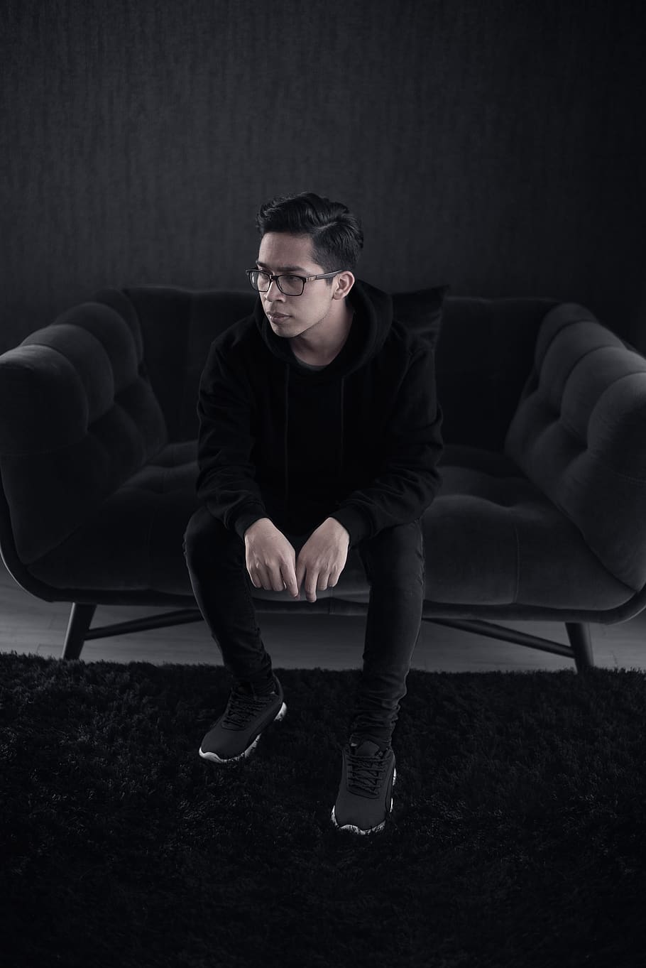 man sitting on sofa, eyeglasses, one person, full length, front view HD wallpaper