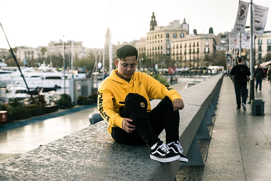 man sitting on concrete wall, human, person, clothing, apparel HD wallpaper