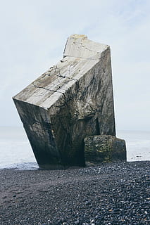 gray stone tablet on shore, rock, building, bunker, square, road HD wallpaper