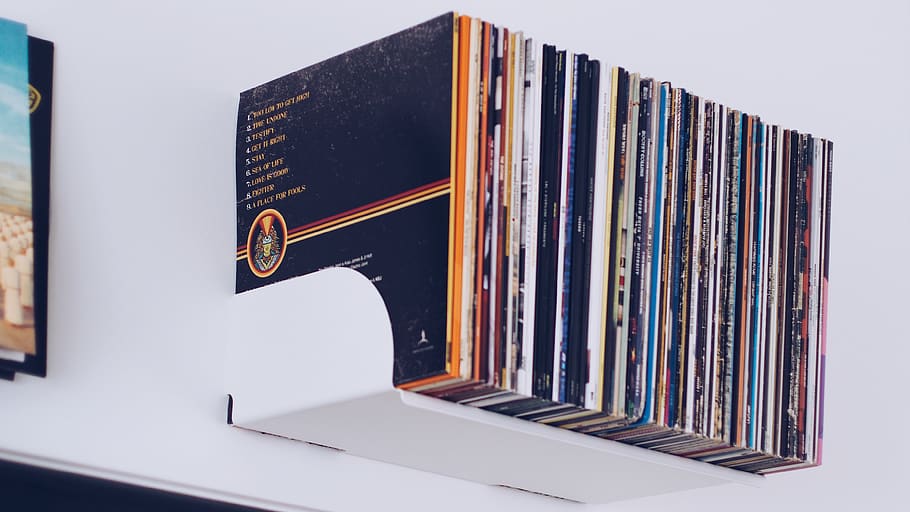 Assorted Book Hanging on White Painted Wall, book bindings, bookcase HD wallpaper