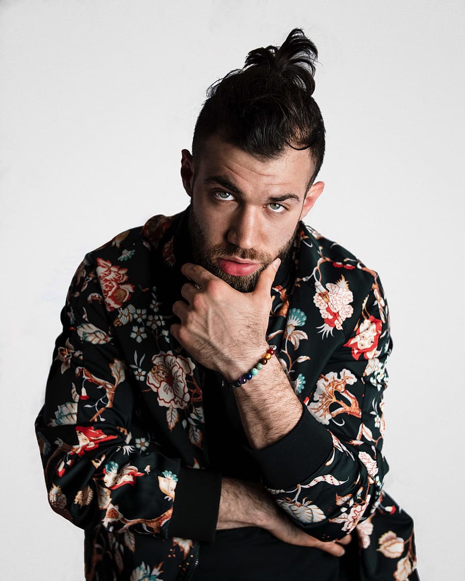 man wearing black, red, and white floral long-sleeved shirt, portrait HD wallpaper