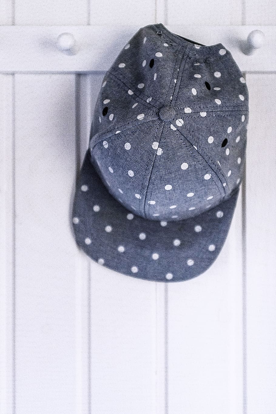 gray and white polka-dot fitted cap on white wooden wall hook, HD wallpaper