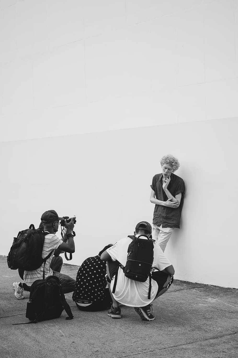 Monochrome Photography of Man Leaning on Wall, backpacks, black-and-white HD wallpaper