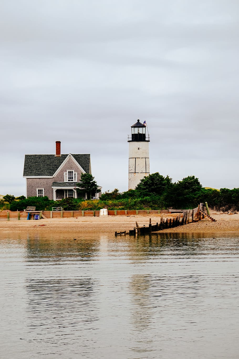 Lighthouse, beach, shore, waterfront, home, tower, building, cloudy HD wallpaper