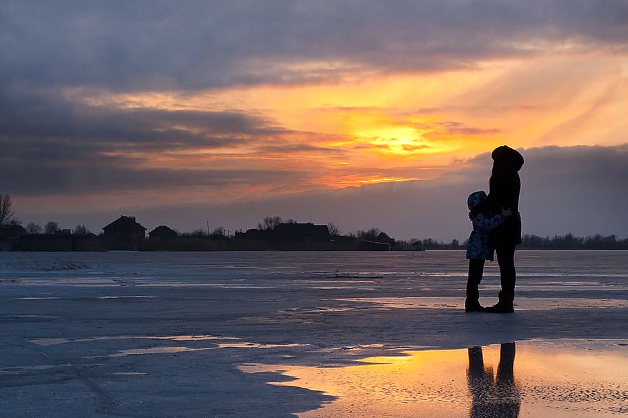Child and Woman Standing Near Water, beach, clouds, cold, dawn HD wallpaper