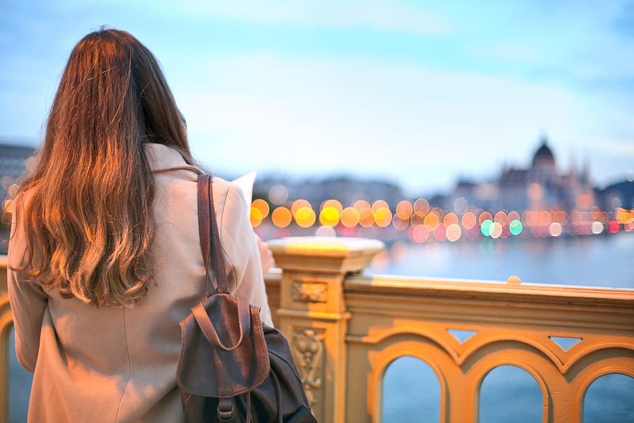 View From Behind, Young Woman In Trench Coat And Black Leather Backpack Looking Over Danube River HD wallpaper