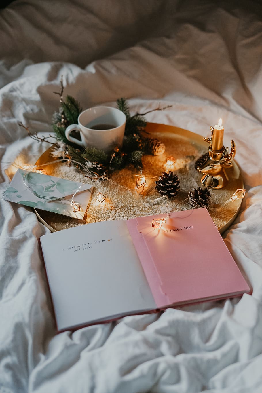 white ceramic teacup on serving tray and book, bed, high angle view HD wallpaper
