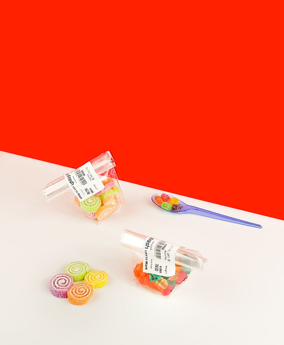 assorted candies on table, red, copy space, studio shot, indoors HD wallpaper