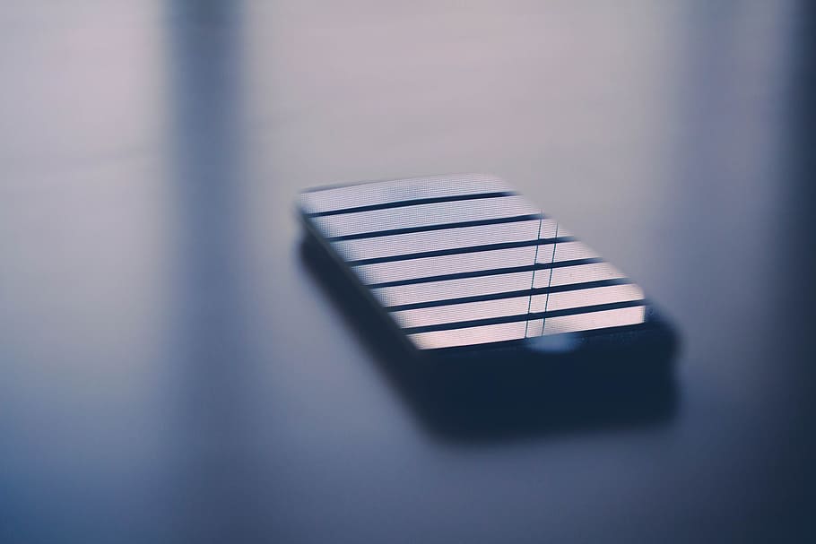 Apple iPhone on a Flat Grey Surface. Black Color Abstract iPhone. HD wallpaper