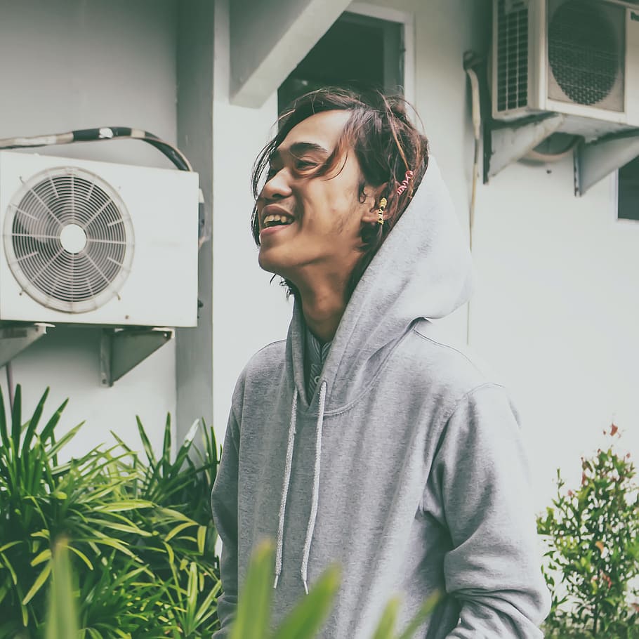 Man Laughing While Standing Near Plants, facial expression, looking HD wallpaper