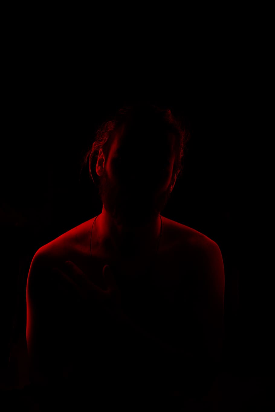 man with red light background, black background, one person, studio shot HD wallpaper
