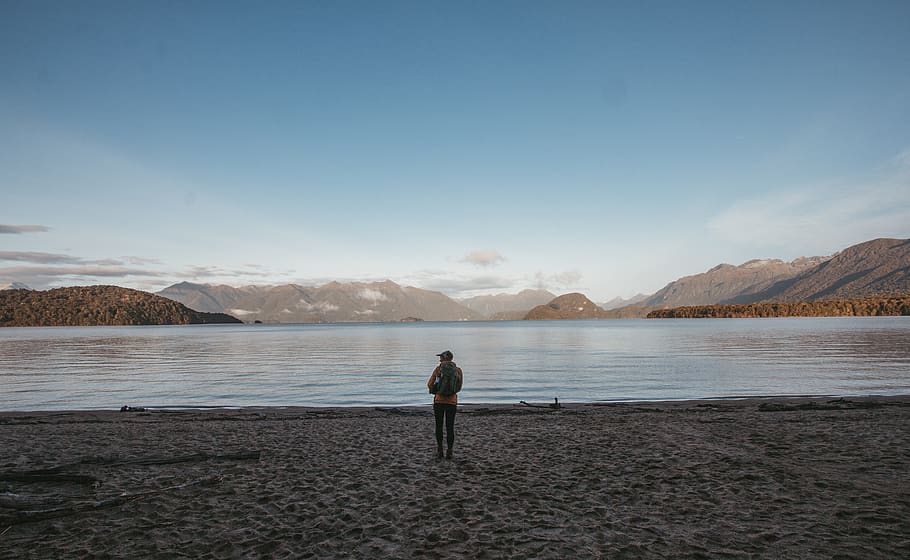 man stands in beach, person, nature, outdoors, water, human, shoreline