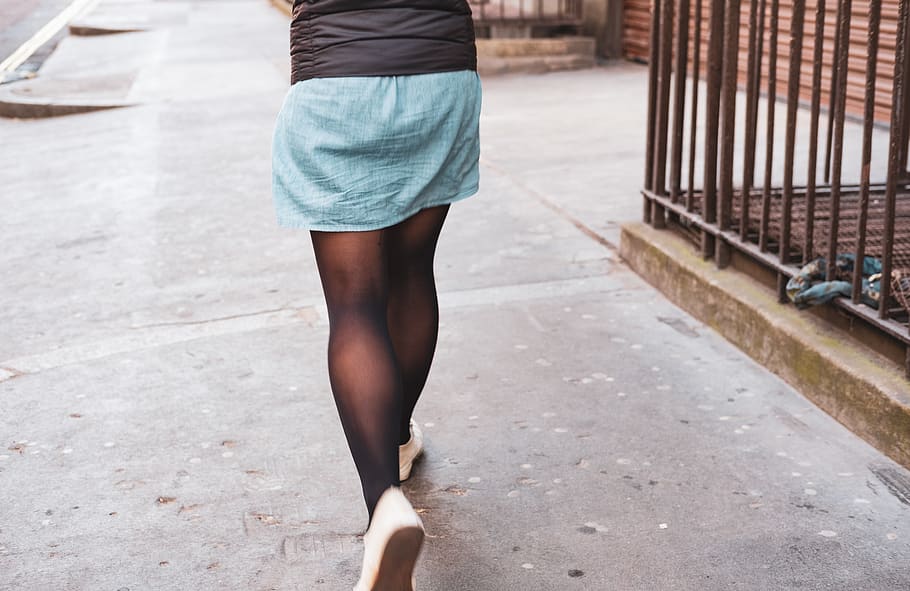 woman walking beside road, clothing, apparel, person, human, skirt