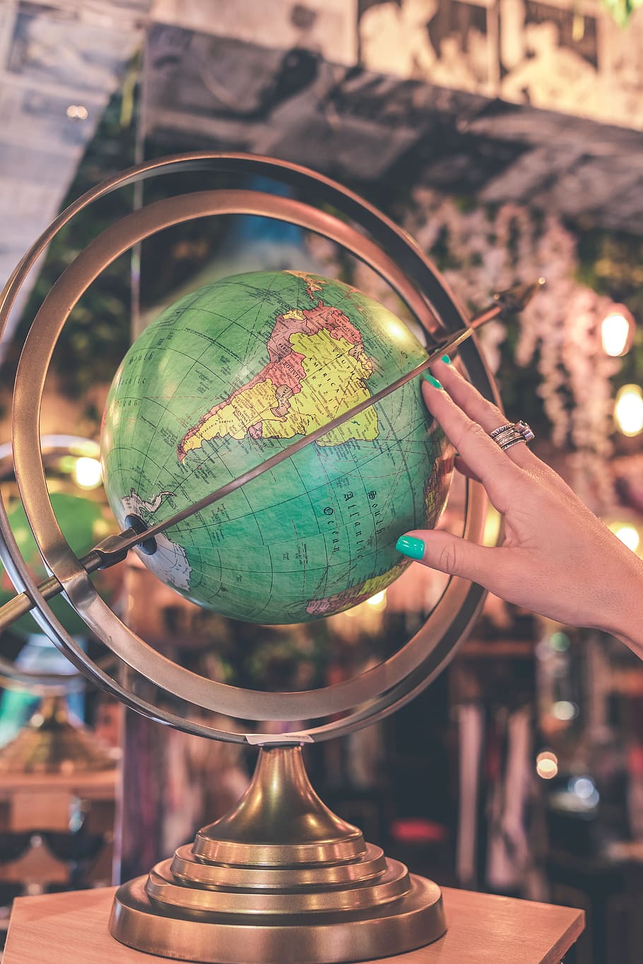 Woman Hand Touches Green Desk Globe, brass, geography, map, object HD wallpaper